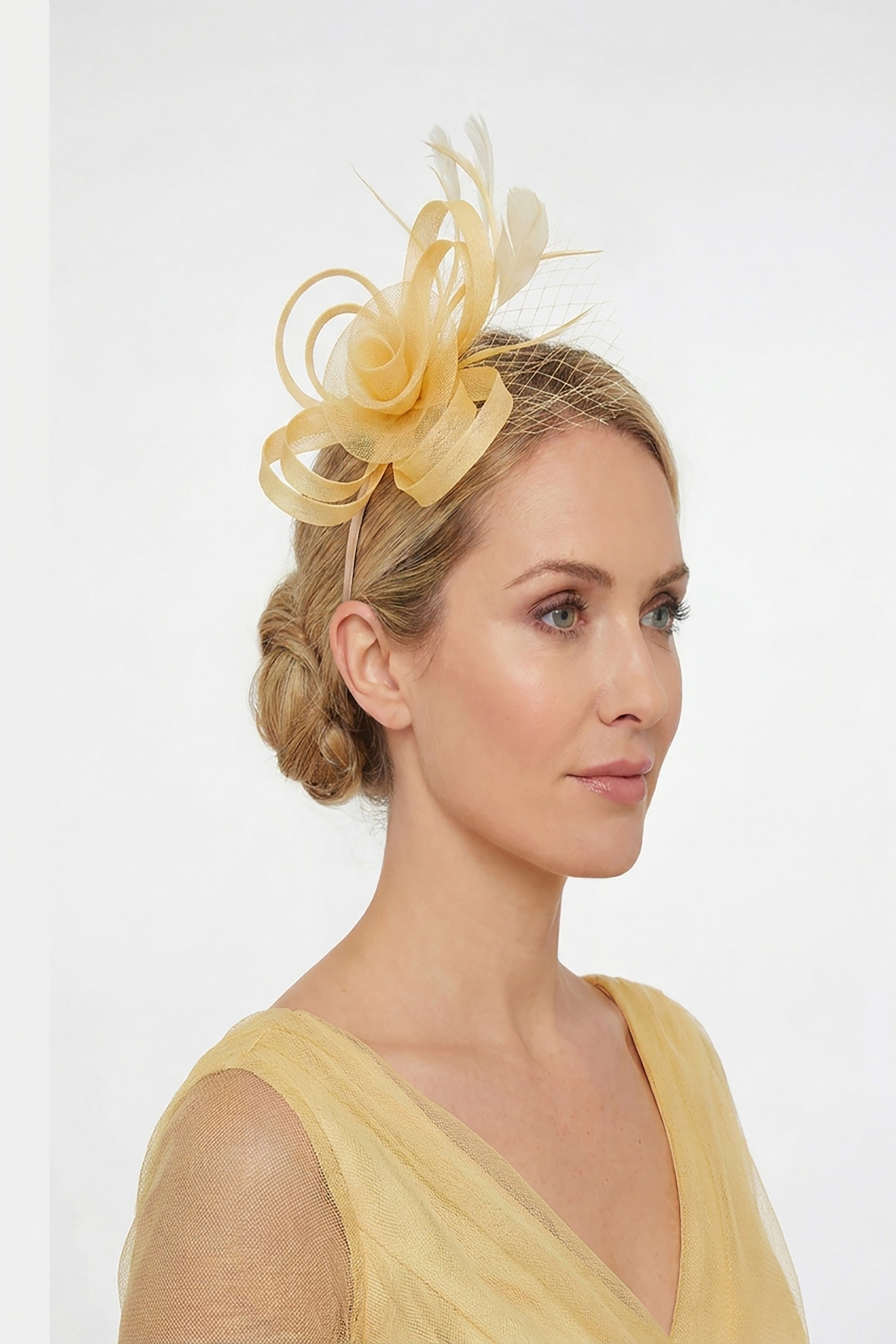 Looped Sinamay Bow Fascinator with Feather & Net Detail