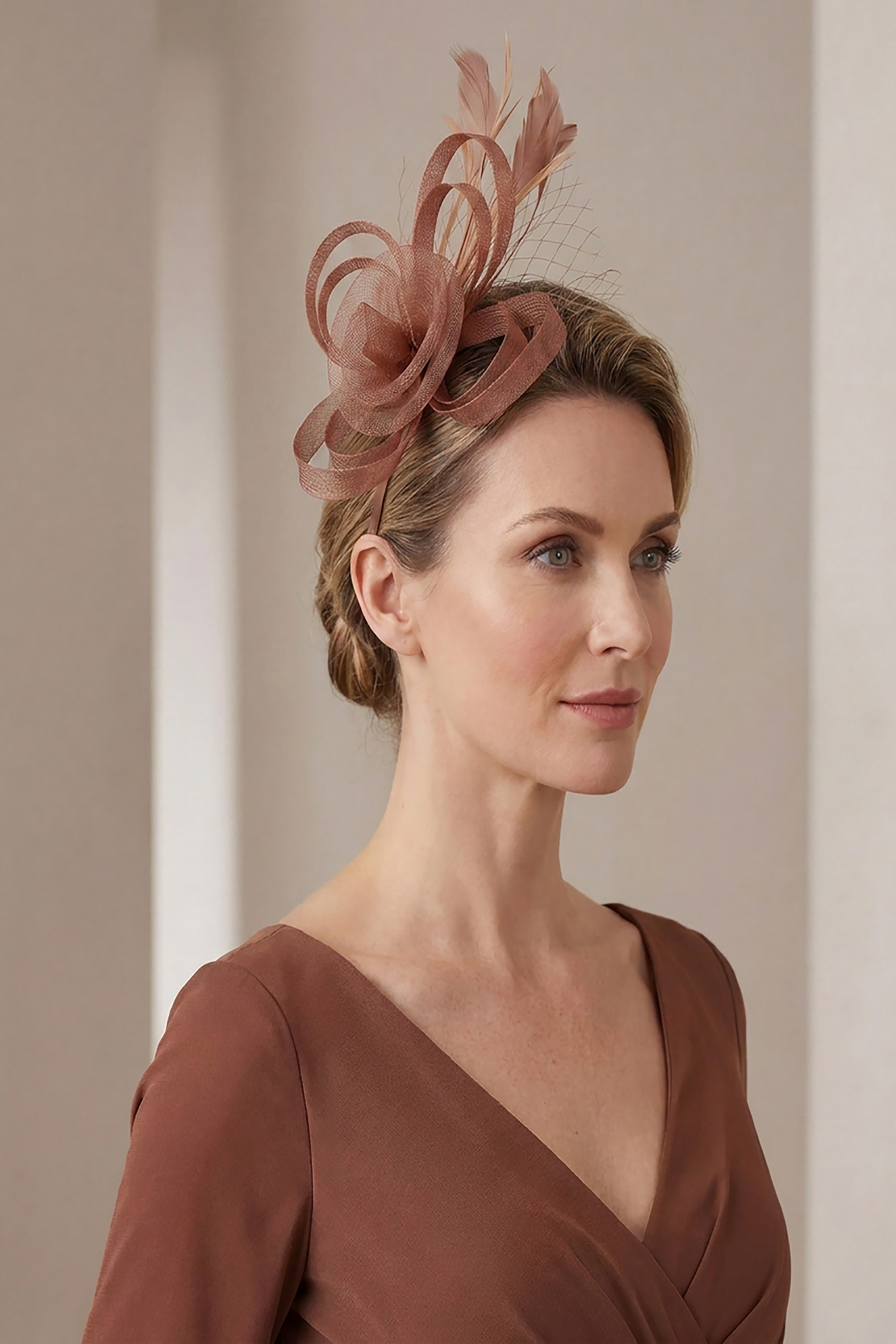Looped Sinamay Bow Fascinator with Feather & Net Detail