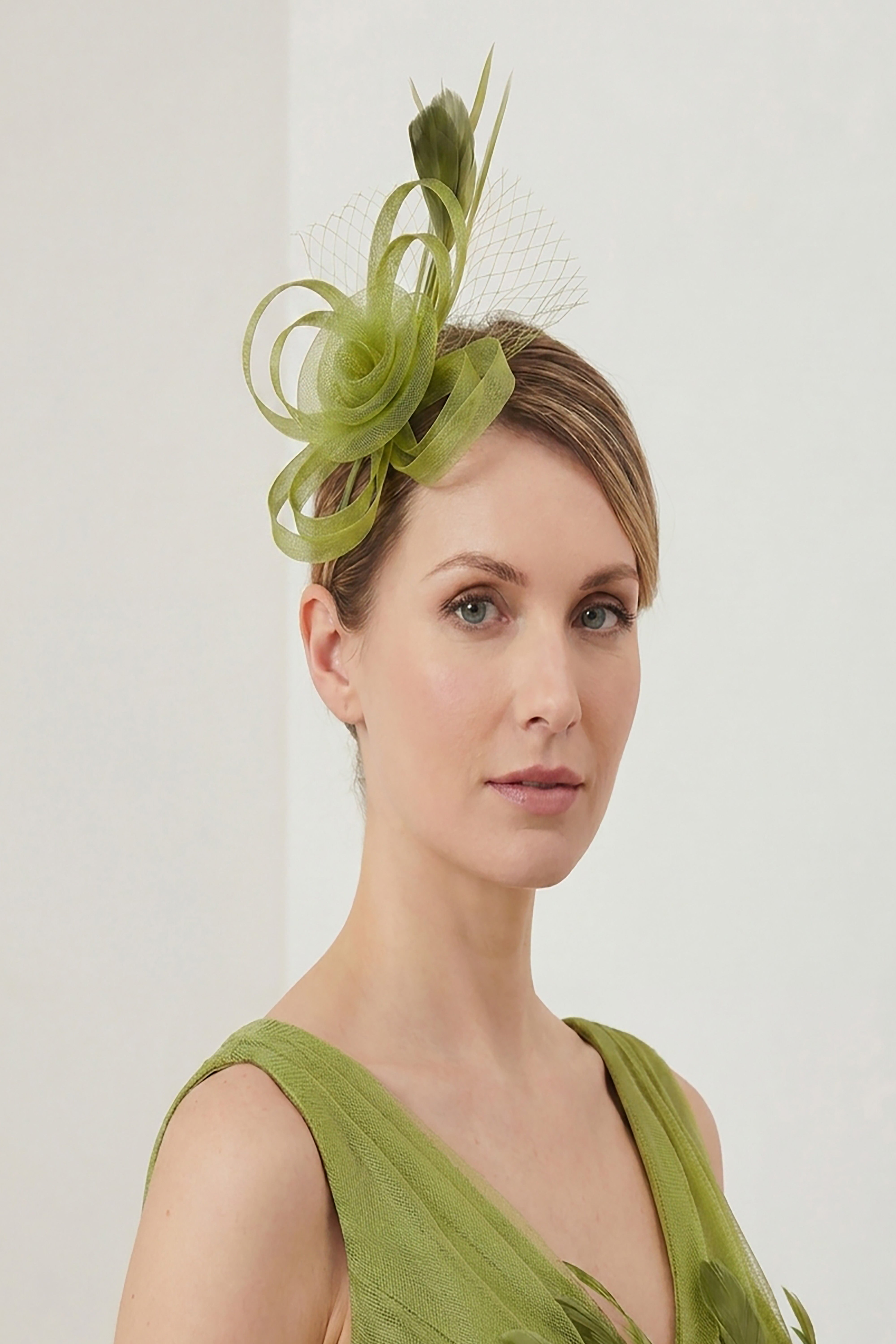 Looped Sinamay Bow Fascinator with Feather & Net Detail