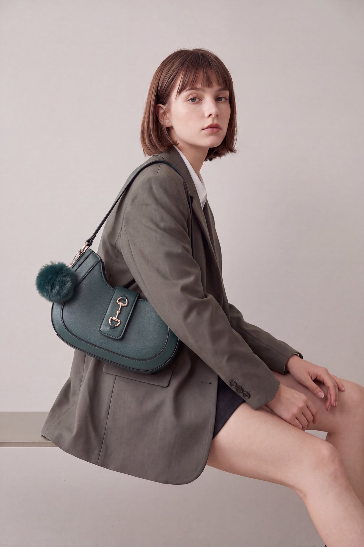 Women’s Curved Shoulder Bag with Pom Pom & Crossbody Strap