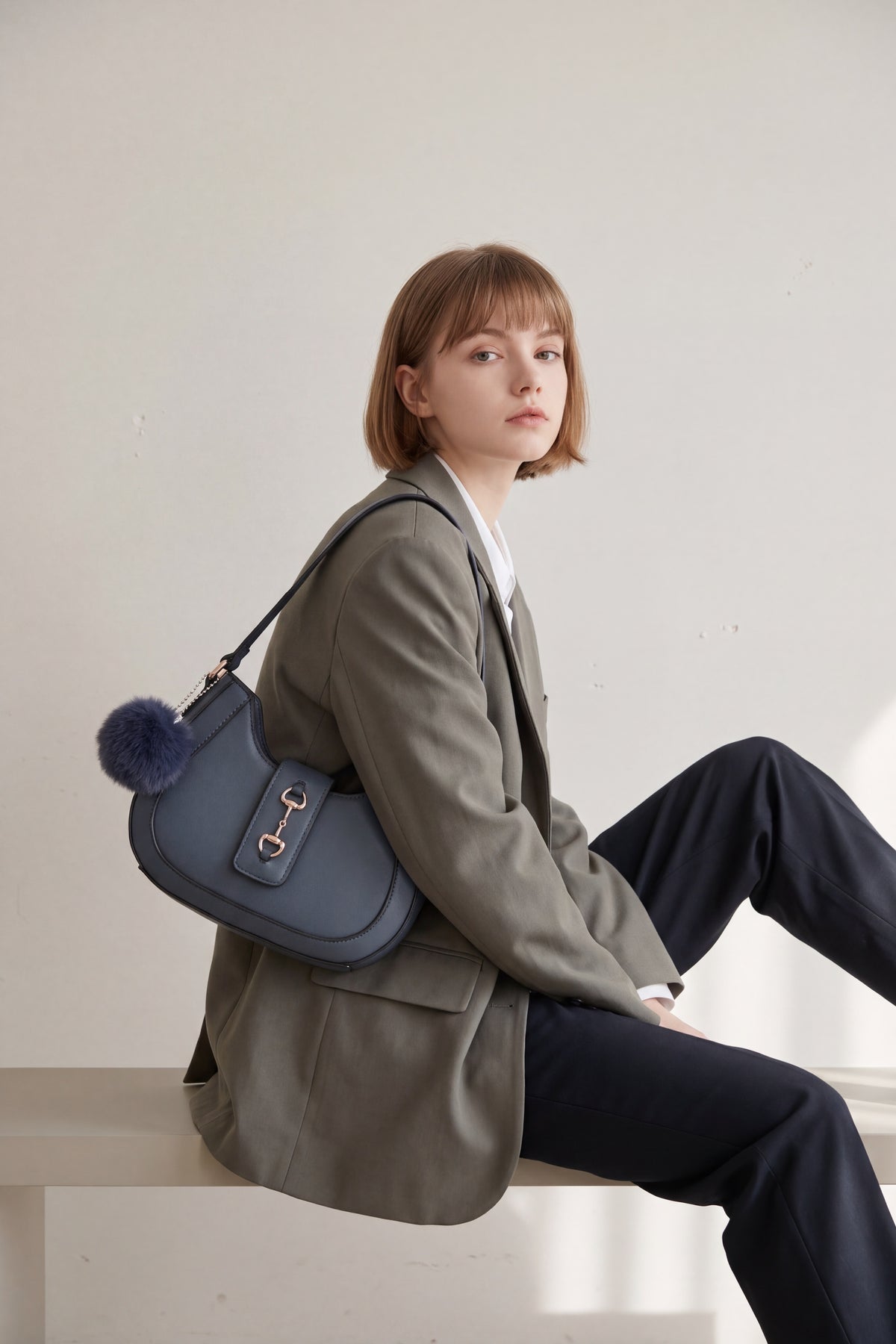 Women’s Curved Shoulder Bag with Pom Pom & Crossbody Strap