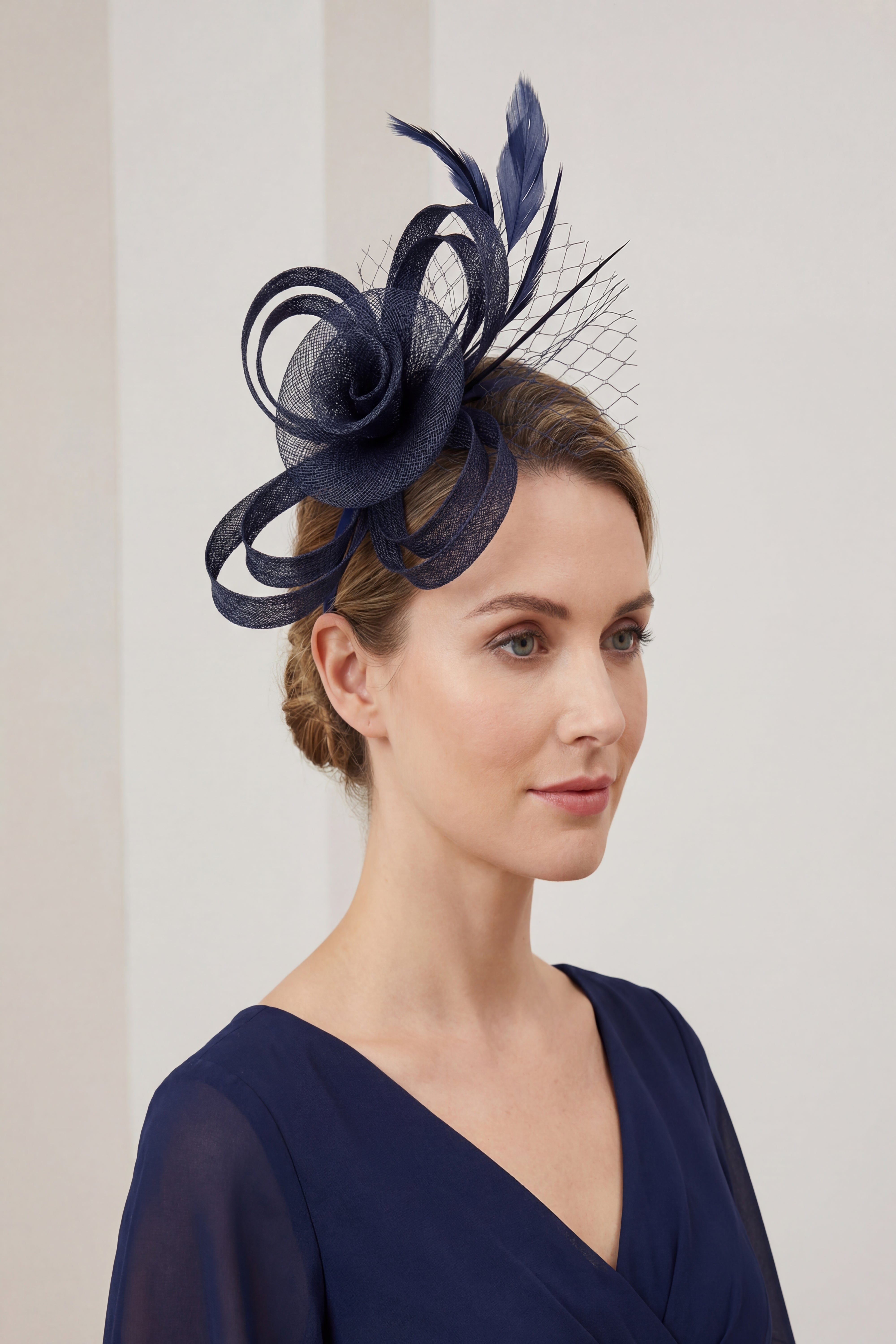 Looped Sinamay Bow Fascinator with Feather & Net Detail